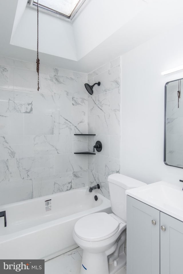 full bathroom featuring vanity, toilet, and tiled shower / bath