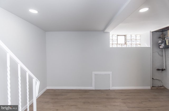 basement featuring hardwood / wood-style floors