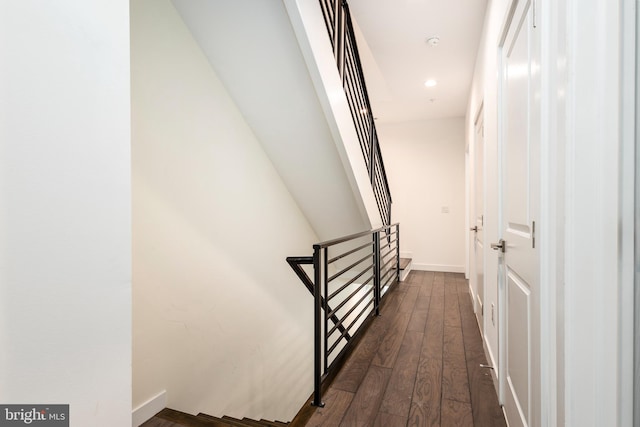 corridor with dark hardwood / wood-style floors