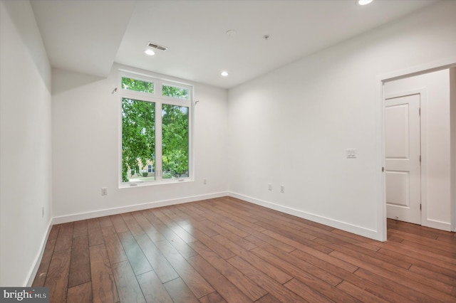 unfurnished room featuring wood-type flooring