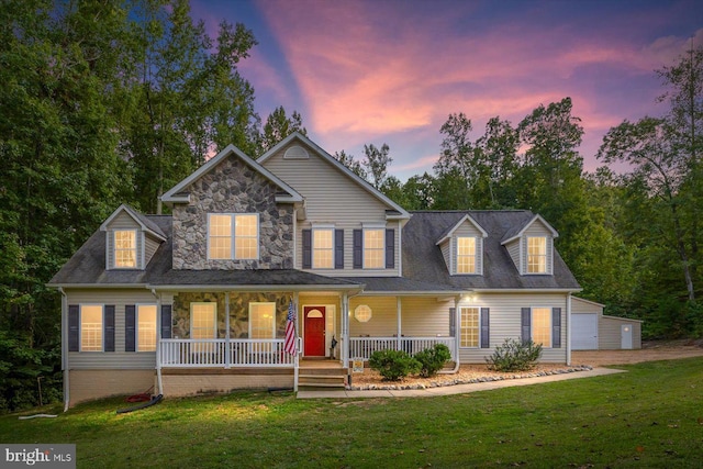 view of front of property with a yard and covered porch