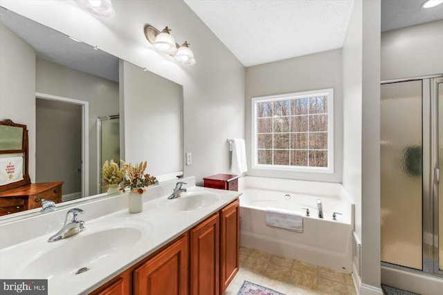 6330 Kleineidam Way, Spotsylvania, VA 22551 - bathroom featuring double vanity, a garden tub, a shower stall, and a sink