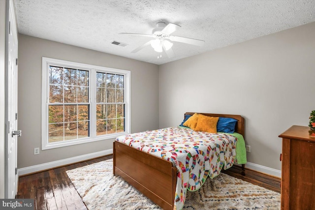 6330 Kleineidam Way, Spotsylvania, VA 22551 - bedroom with baseboards, visible vents, and wood finished floors