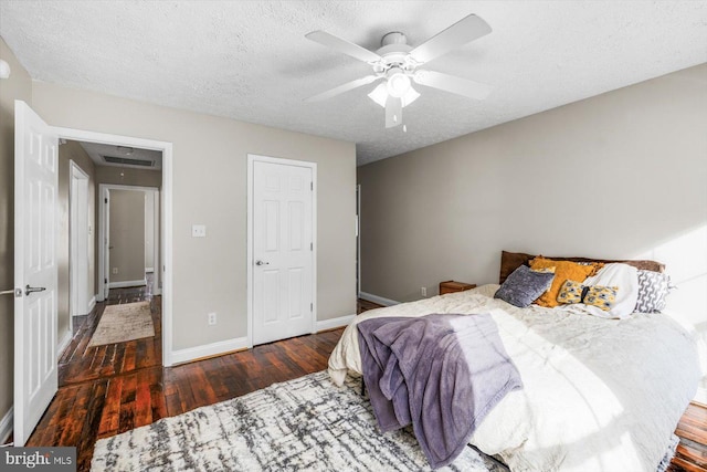 6330 Kleineidam Way, Spotsylvania, VA 22551 - bedroom with a textured ceiling, baseboards, hardwood / wood-style floors, and a ceiling fan