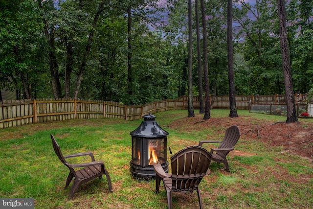 view of yard with an outdoor fire pit