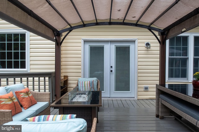 deck with french doors and an outdoor hangout area