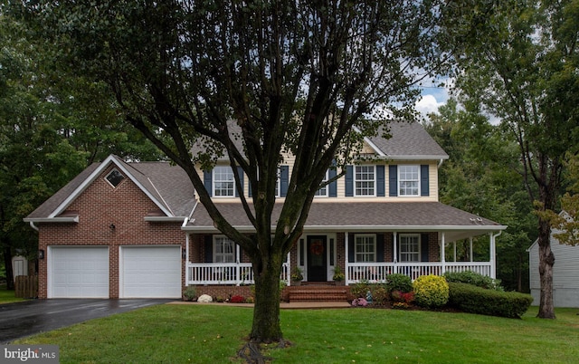 view of front of home featuring a front yard and a porch