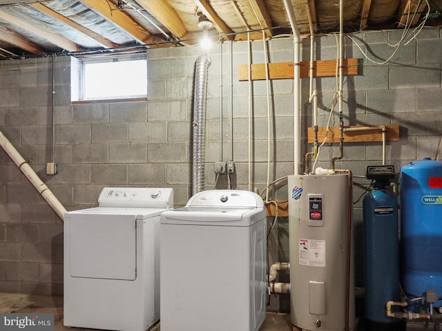 laundry area featuring water heater and independent washer and dryer