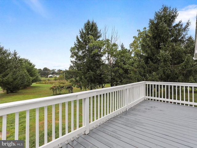 wooden deck with a yard