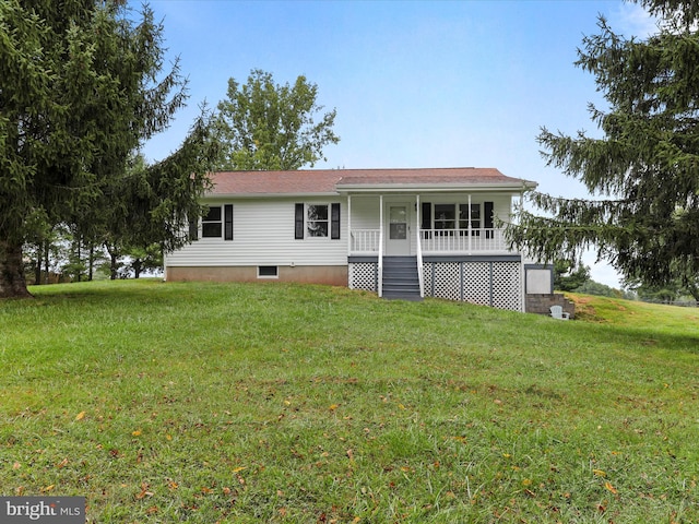 view of front facade with covered porch and a front yard