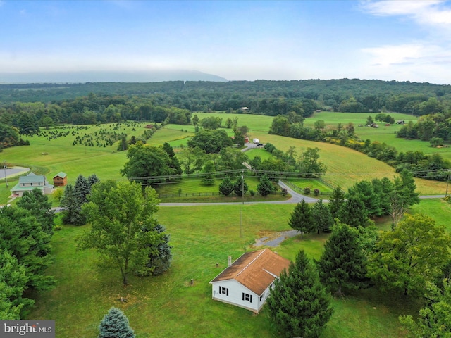 birds eye view of property with a rural view