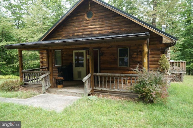 log-style house featuring a porch