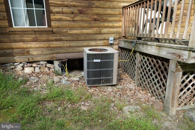 details with central AC unit and log walls