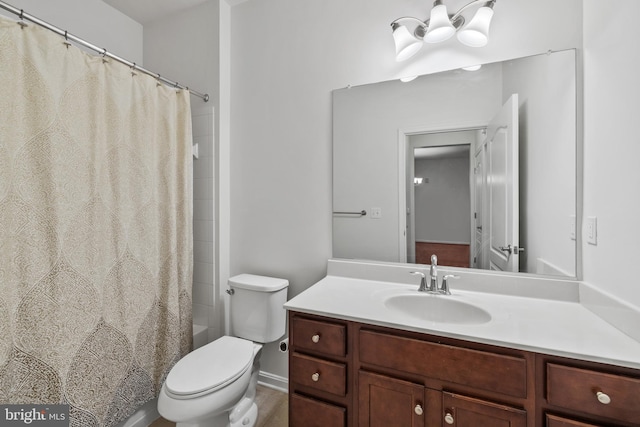 full bathroom featuring toilet, vanity, and shower / tub combo