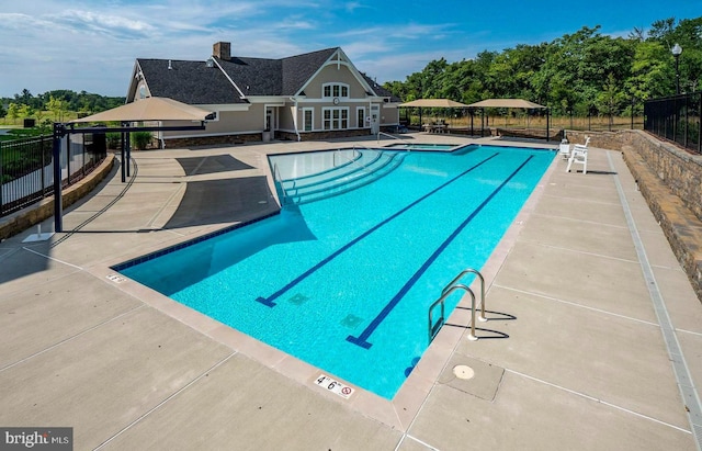 view of swimming pool with a patio area