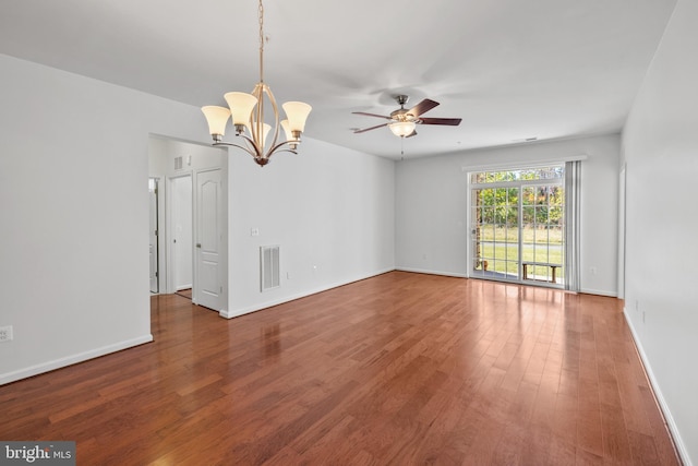 spare room with wood-type flooring and ceiling fan with notable chandelier