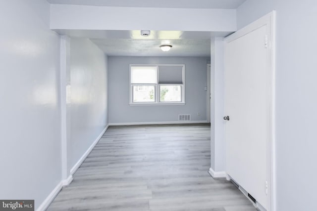 unfurnished room featuring light hardwood / wood-style floors