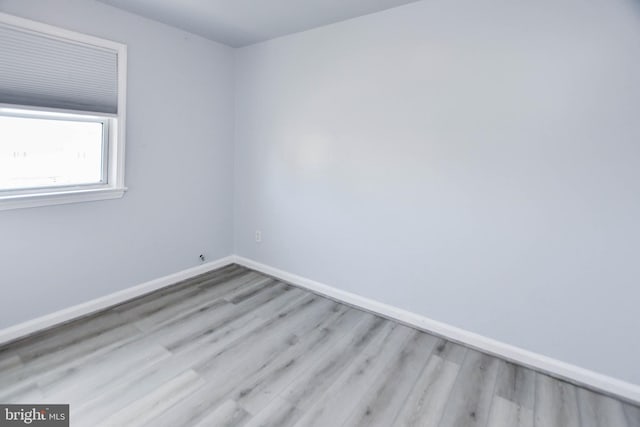 empty room with light hardwood / wood-style floors