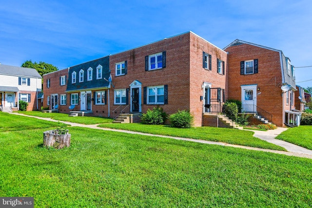 view of front of house featuring central AC unit and a front lawn