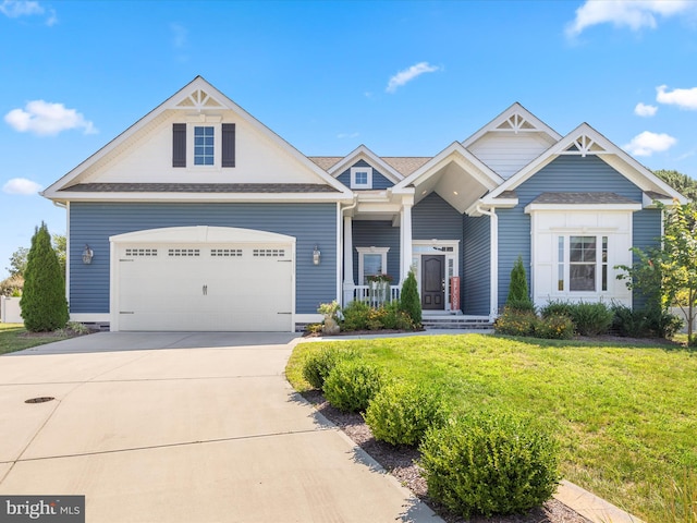 view of front facade with a garage and a front lawn