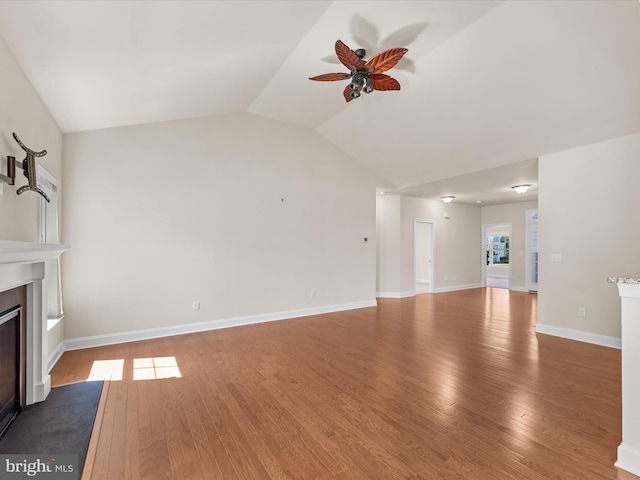 unfurnished living room with lofted ceiling, hardwood / wood-style floors, and ceiling fan