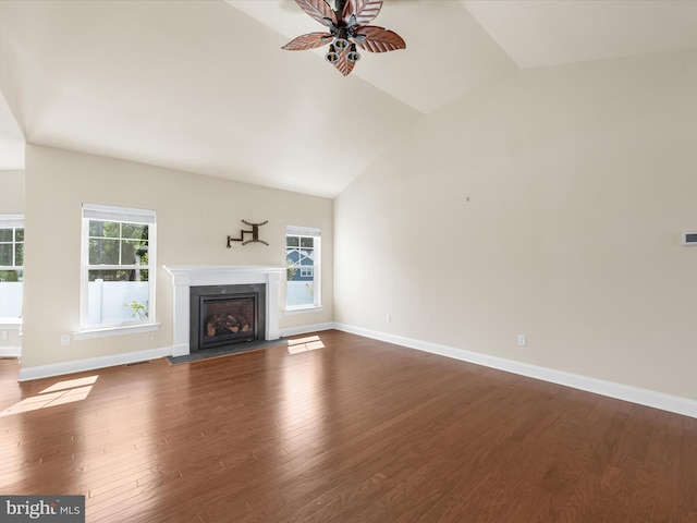 unfurnished living room with lofted ceiling, ceiling fan, and wood-type flooring