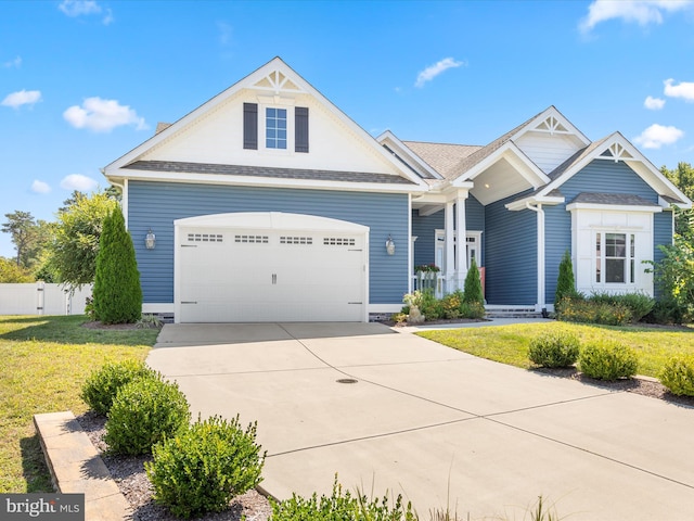 view of front of house with a garage and a front yard