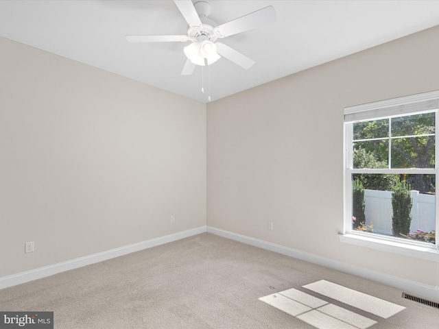 empty room with carpet and ceiling fan