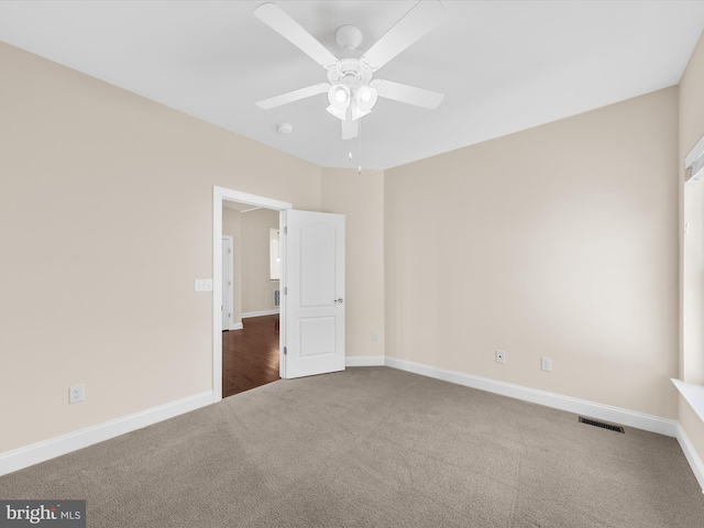 unfurnished bedroom with ceiling fan and carpet