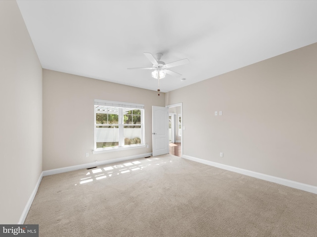 unfurnished room with ceiling fan and carpet floors