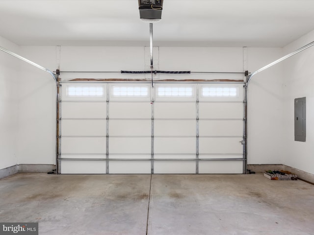 garage featuring electric panel and a garage door opener