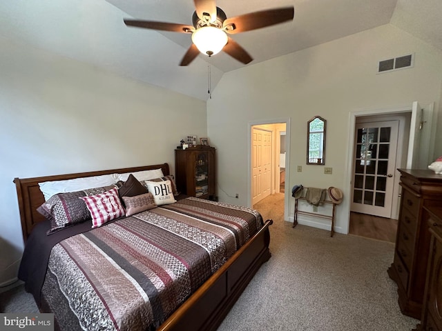 carpeted bedroom featuring vaulted ceiling and ceiling fan