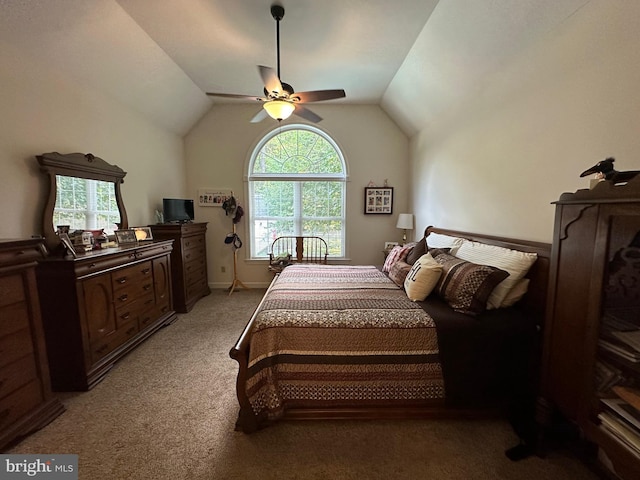 bedroom featuring vaulted ceiling, light carpet, and ceiling fan