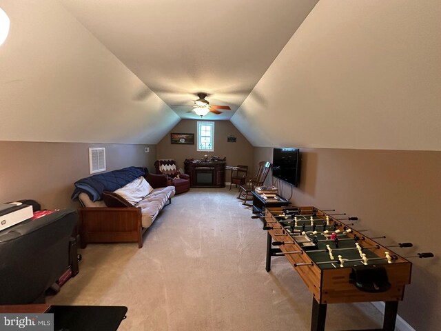 recreation room featuring lofted ceiling, carpet flooring, and ceiling fan