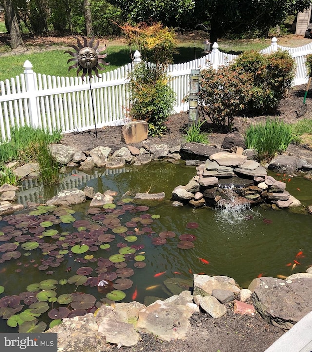 view of yard with a garden pond