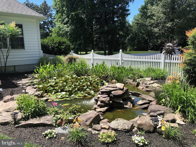 view of yard with a garden pond