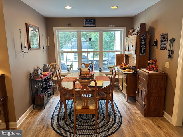 dining space with light wood-type flooring