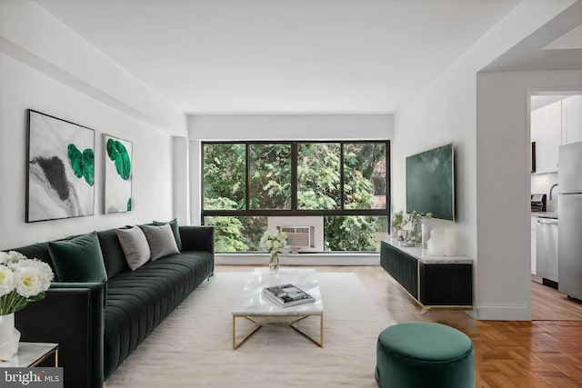 living room with parquet floors and a wall mounted AC