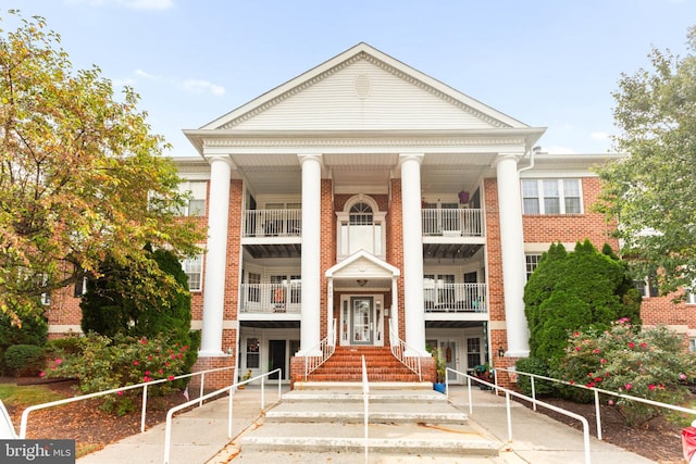 view of front of house featuring a balcony