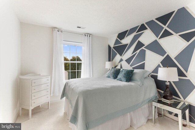 bedroom with light colored carpet