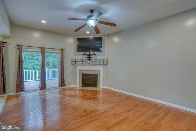 unfurnished living room with light hardwood / wood-style floors and ceiling fan