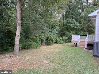 view of yard with a deck