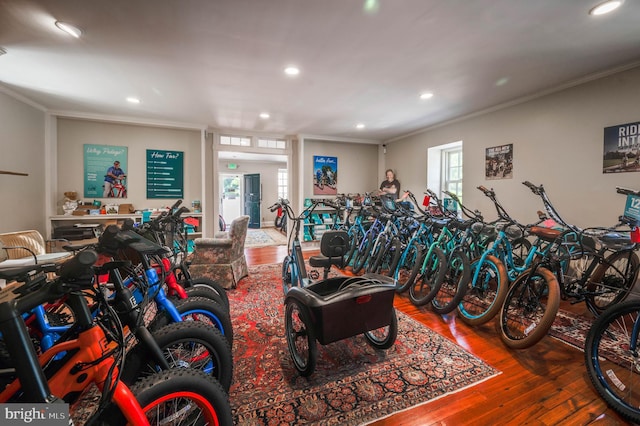 rec room featuring ornamental molding and hardwood / wood-style floors