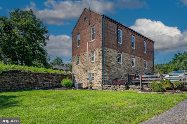 view of home's exterior with a yard