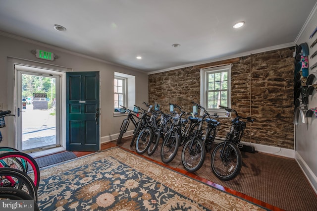 interior space featuring crown molding and hardwood / wood-style floors