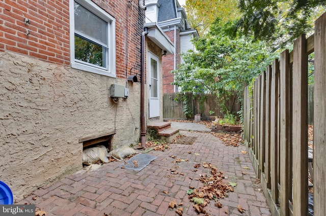 view of side of home featuring a patio area