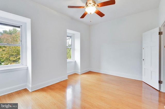 unfurnished room featuring light hardwood / wood-style flooring and ceiling fan