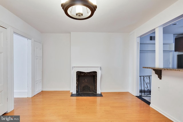 unfurnished living room featuring light hardwood / wood-style floors