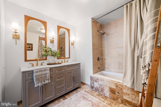 bathroom featuring vanity and shower / bathtub combination with curtain