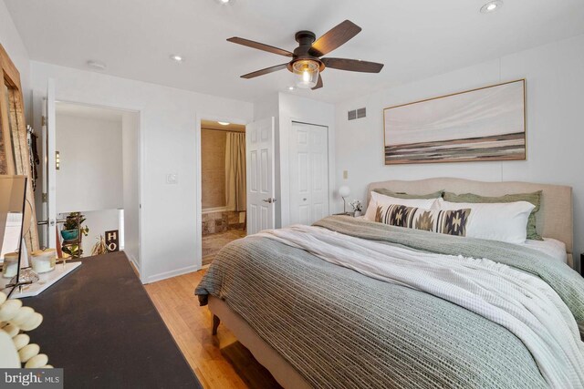 bedroom featuring light hardwood / wood-style floors and ceiling fan